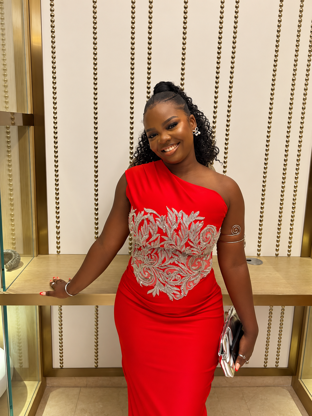 Esther smiling in a red top