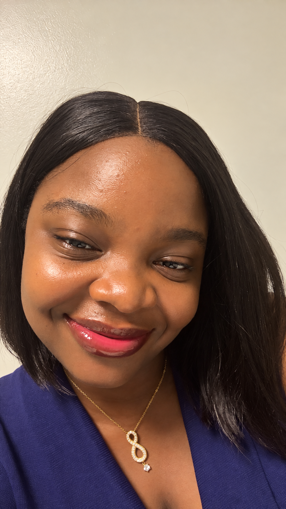 Esther smiling in a navy top
